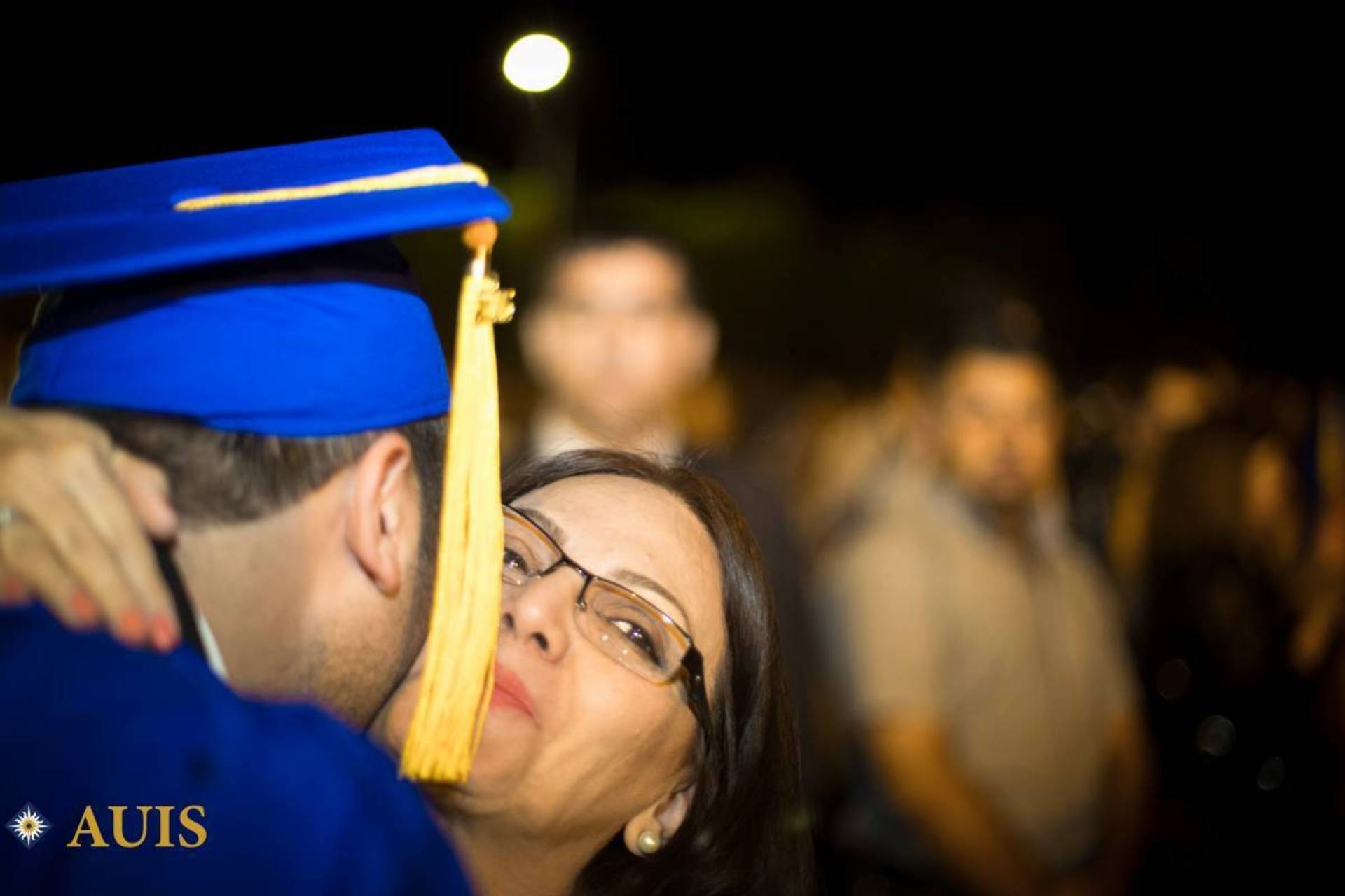 Graduate with parent at 2015 commencement